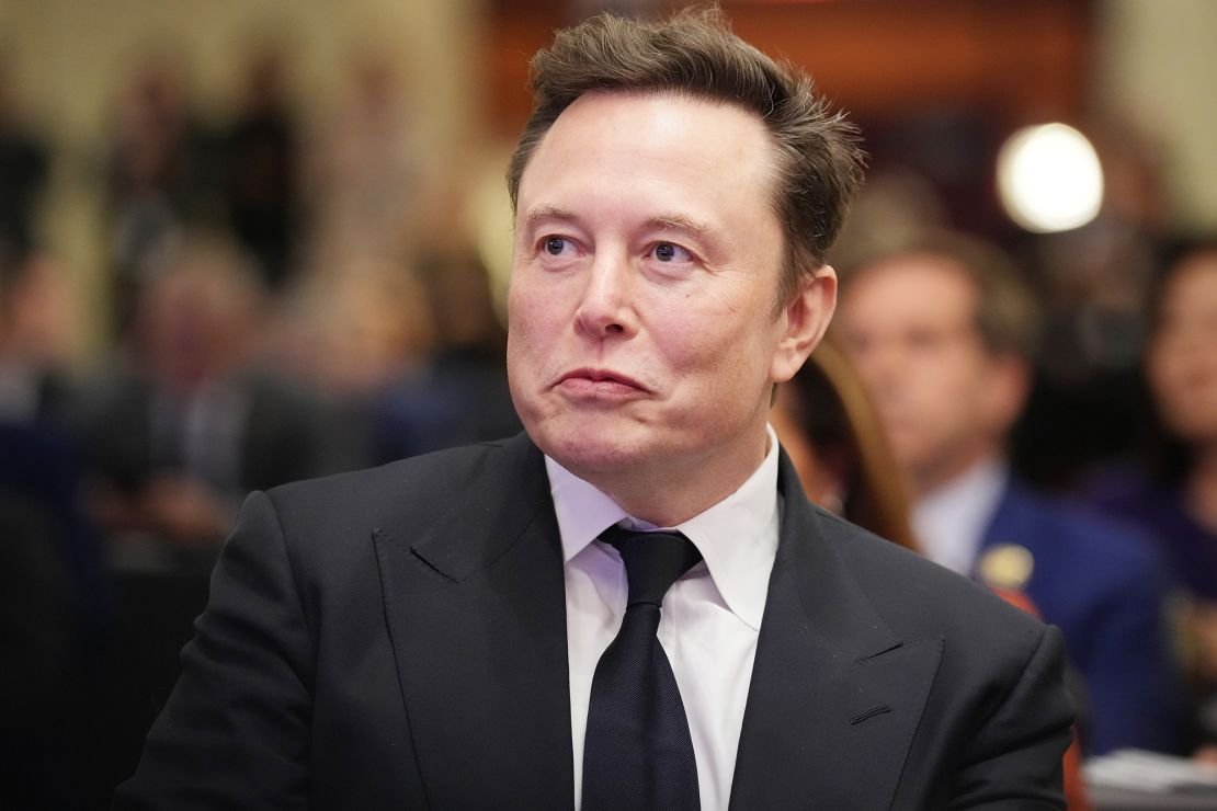 Elon Musk listens in November as then-President-elect Donald Trump addresses the House Republican Conference session at the Hyatt Regency on Capitol Hill on November 13, 2024 in Washington, DC.