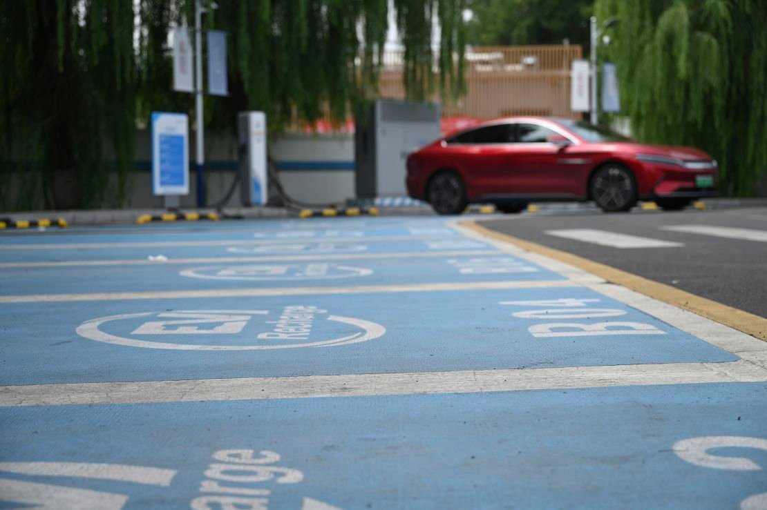 An electric car is parked at a charging station in Beijing on August 15, 2024.