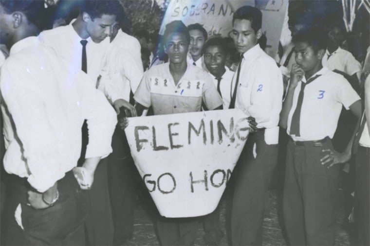 A student with a banner saying Fleming Go Home on January 9, 1964.