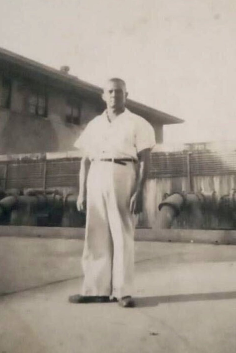 John Miller, Marjorie Miller's great-grandfather, stands next to a lock at the Panama Canal, where he worked in the 1940s.