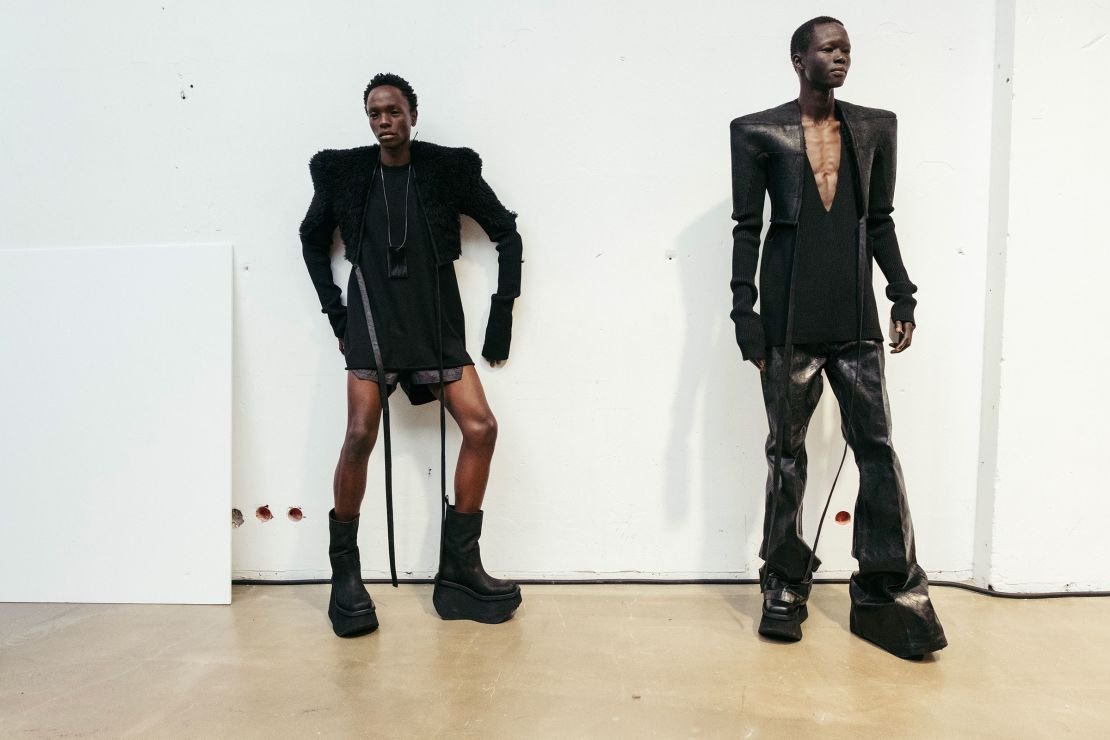 Models pose backstage during Rick Owens' show, where the American designer unveiled his new futuristic collection.