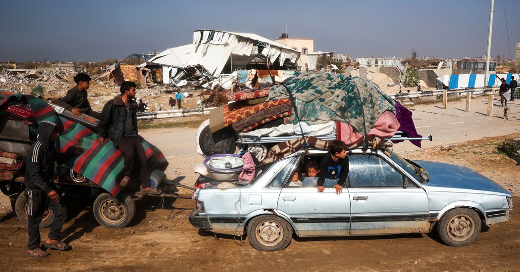 Gazans Crowd the Road North, Joyful but Anxious