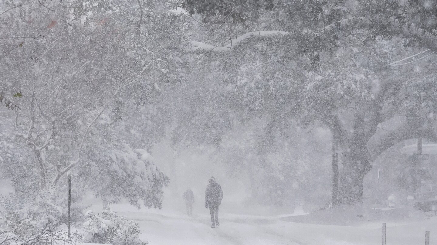 Winter storm that dropped record-breaking snow in New Orleans spreads into Florida and the Carolinas