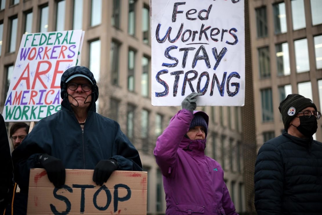 Protesters rally outside of the Theodore Roosevelt Federal Building headquarters of the US Office of Personnel Management on February 5, in Washington, DC. 