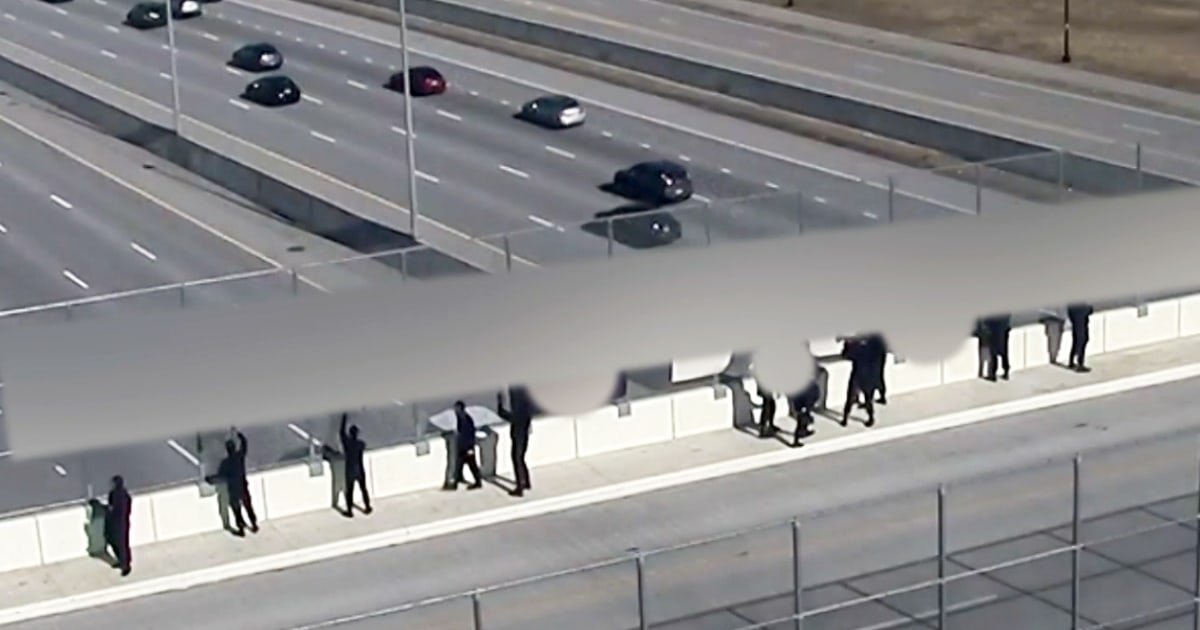 Demonstrators with Nazi flags leave Cincinnati-area highway overpass after residents confront them