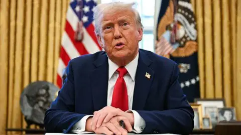 Getty Images speak to US President Donald Trump Press as he signs an executive order to create an American sovereign Wealth Fund at the White House's Oval Office on February 3, 2025.