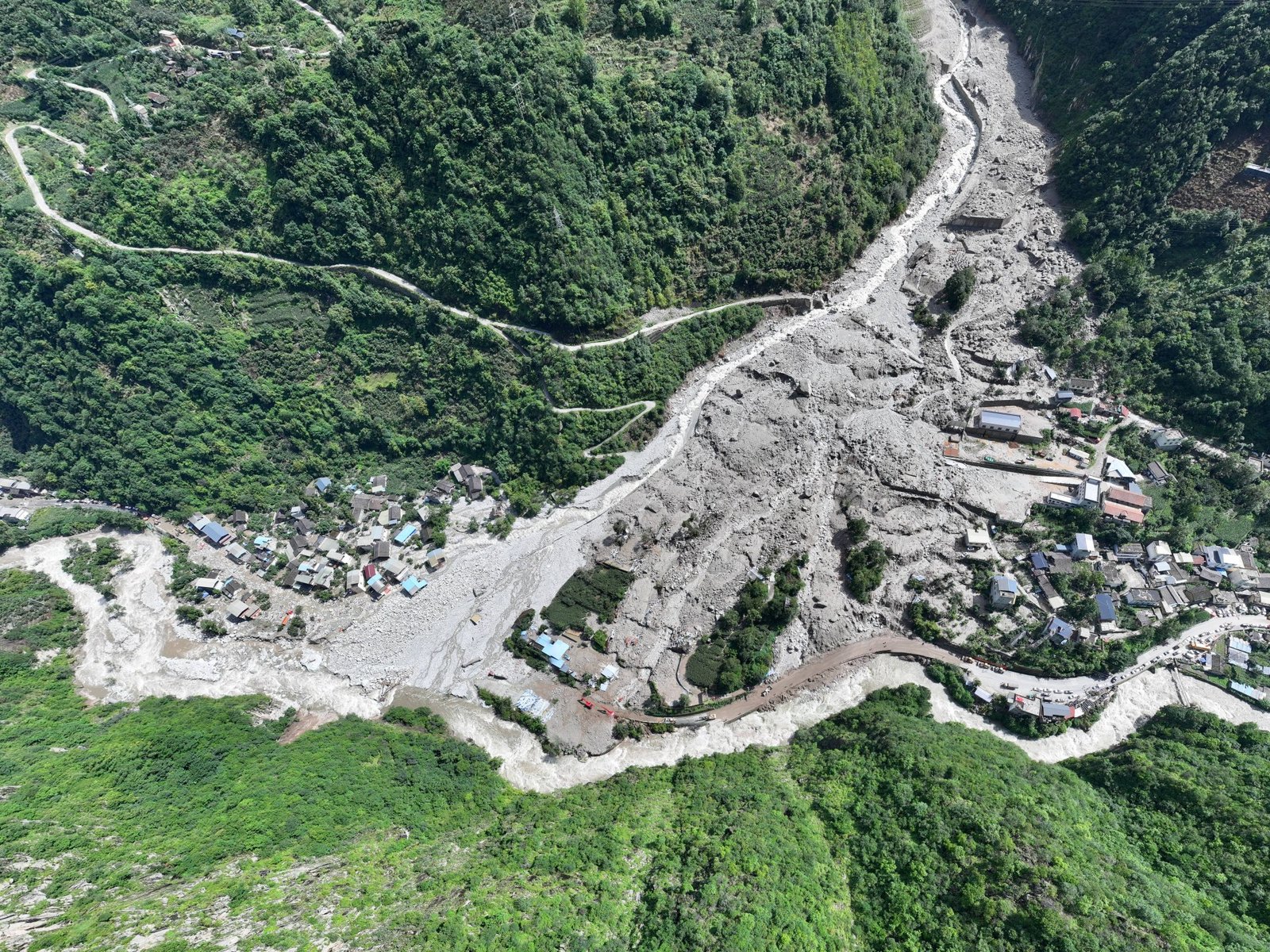 China hunts for survivors following landslide in Sichuan province | Climate News