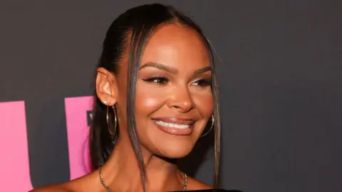 Getty Images have long, black hair and brown eyes of Samantha Mamba and smile at the award function 