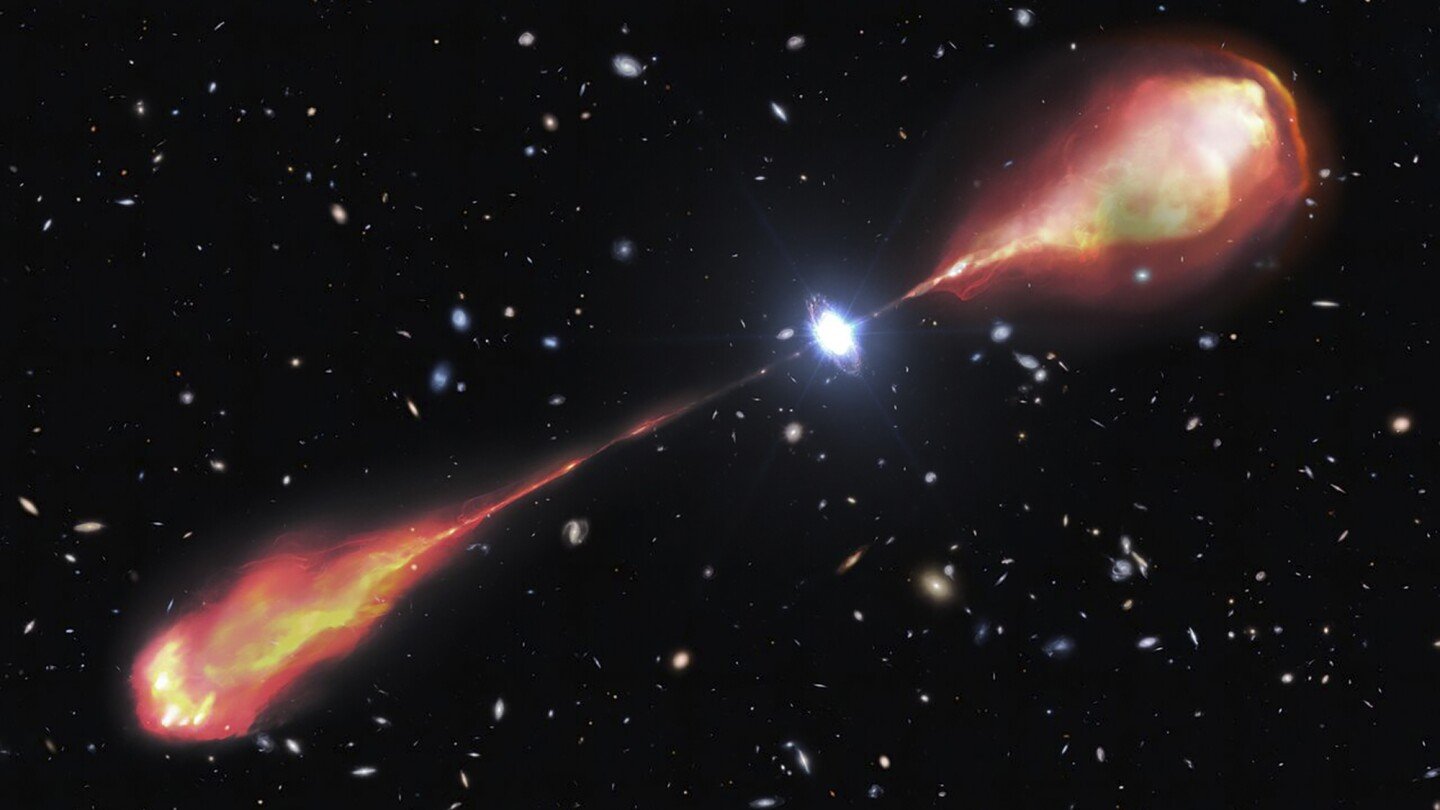 Telescopes spy a monster radio jet streaming from a bright and early object in the universe