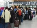 On August 5, 2022, people are in line before entering the security zone at Pierreon International Airport in Toronto. 