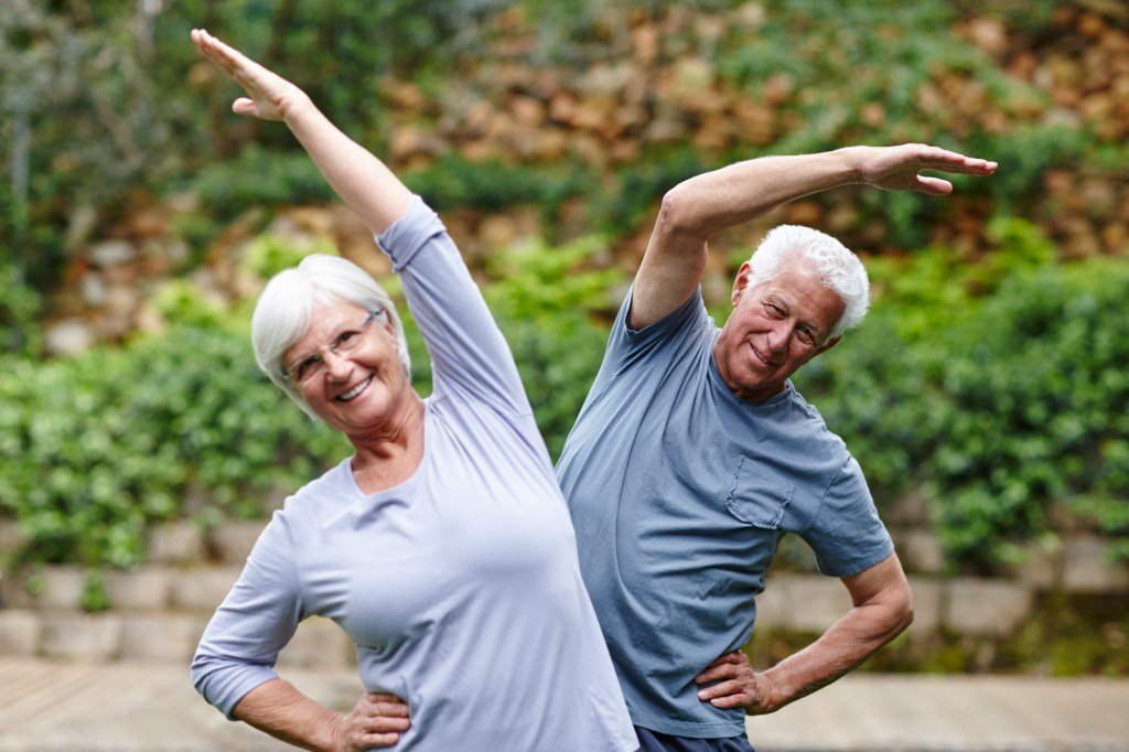 Happy Older couple exercise