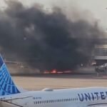 American Airlines fire: Passengers deplane on the wing after engine catches fire at Denver airport