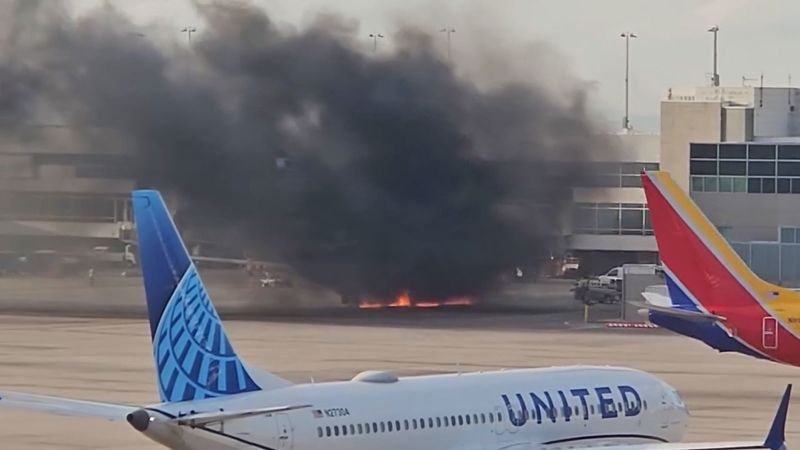 American Airlines fire: Passengers deplane on the wing after engine catches fire at Denver airport