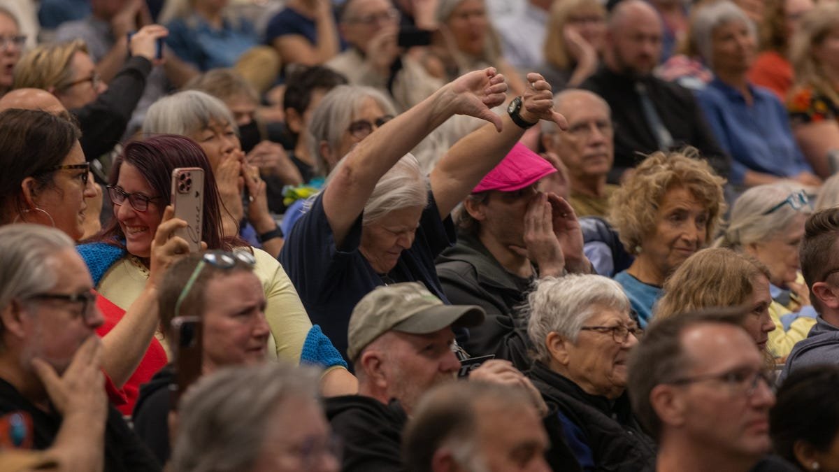 Edwards met with anger over Trump, Musk at town hall