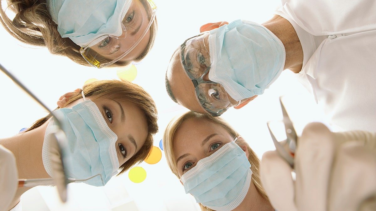 Dental doctors stare on the camera