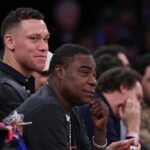 Comedian Tracy Morgan wheeled off after vomiting on Madison Square Garden court, leading to delay in Knicks-Heat game