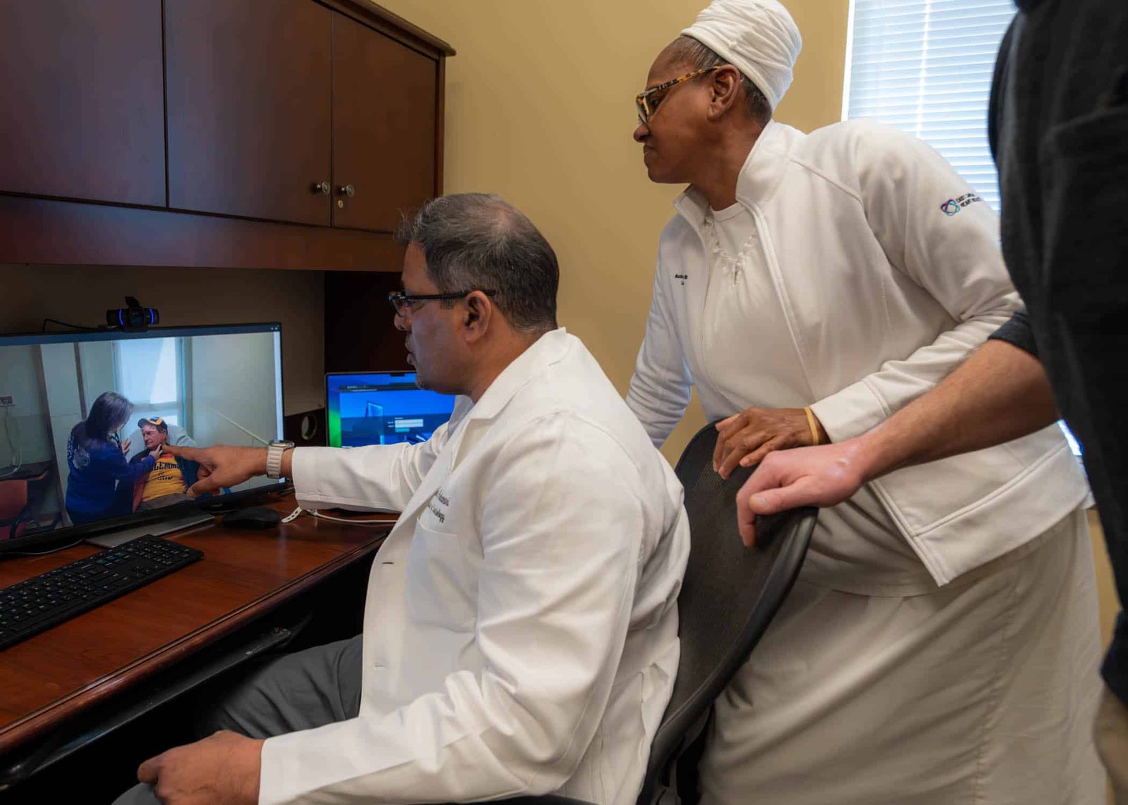 Dr. Sivakumar Ardhanari, cardiologist, ECU Health, and Maxine Shepherd, nurse, ECU Health, treat a patient from Edenton, North Carolina, virtually.