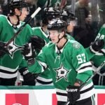 Dallas Stars center Wyatt Johnston (53) celebrates with the bench after scoring against the Calgary Flames in the second period of an NHL hockey game in Dallas, Thursday, March 6, 2025. (AP Photo/Tony Gutierrez)