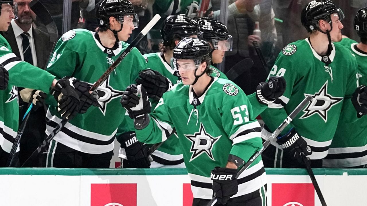 Dallas Stars center Wyatt Johnston (53) celebrates with the bench after scoring against the Calgary Flames in the second period of an NHL hockey game in Dallas, Thursday, March 6, 2025. (AP Photo/Tony Gutierrez)