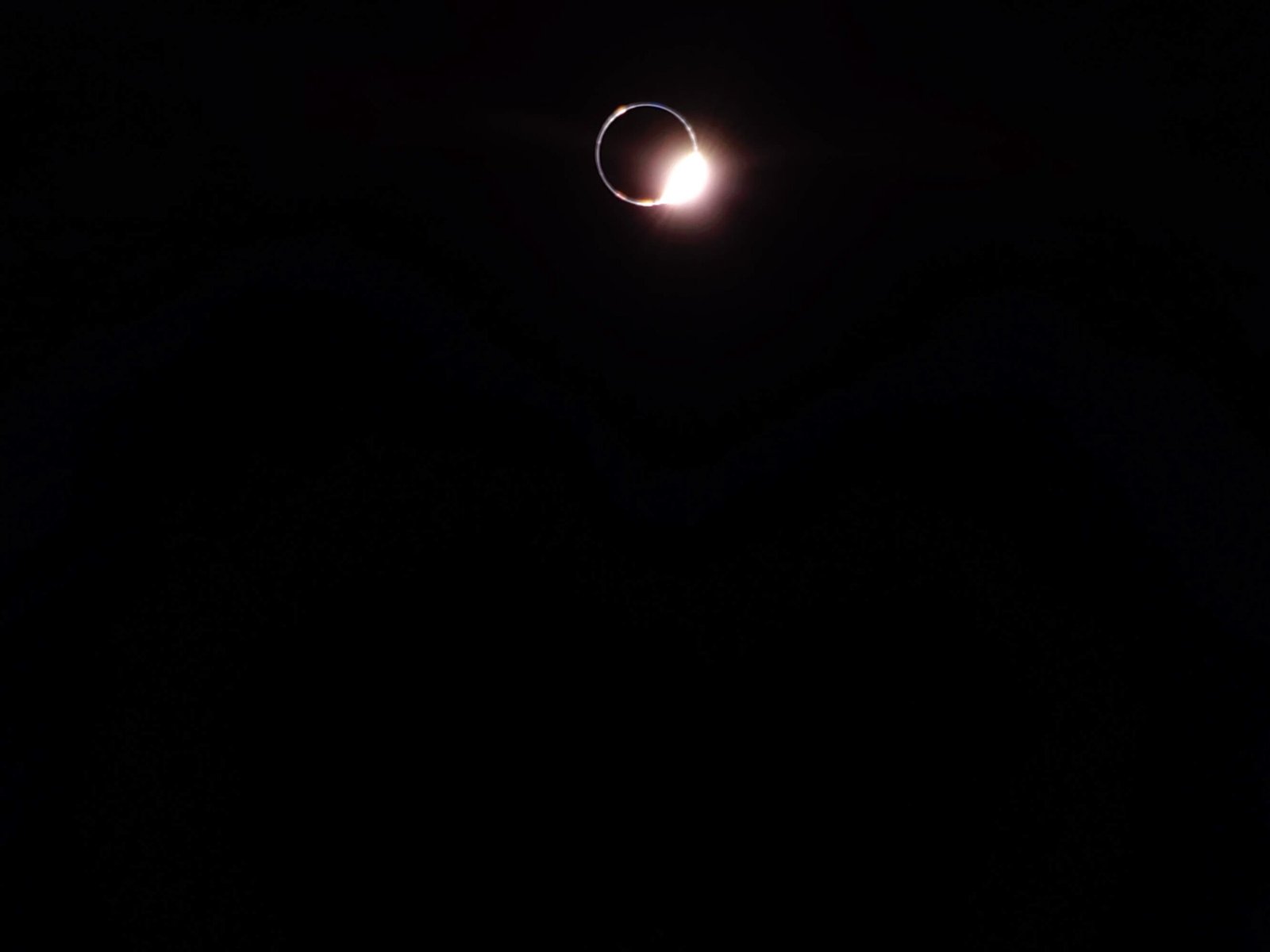 View of Earth blocking the light of the sun, creating a bright ring of light in the lunar sky captured by Firefly's Blue Ghost Mission 1 lunar lander from its landing site on the Moon.