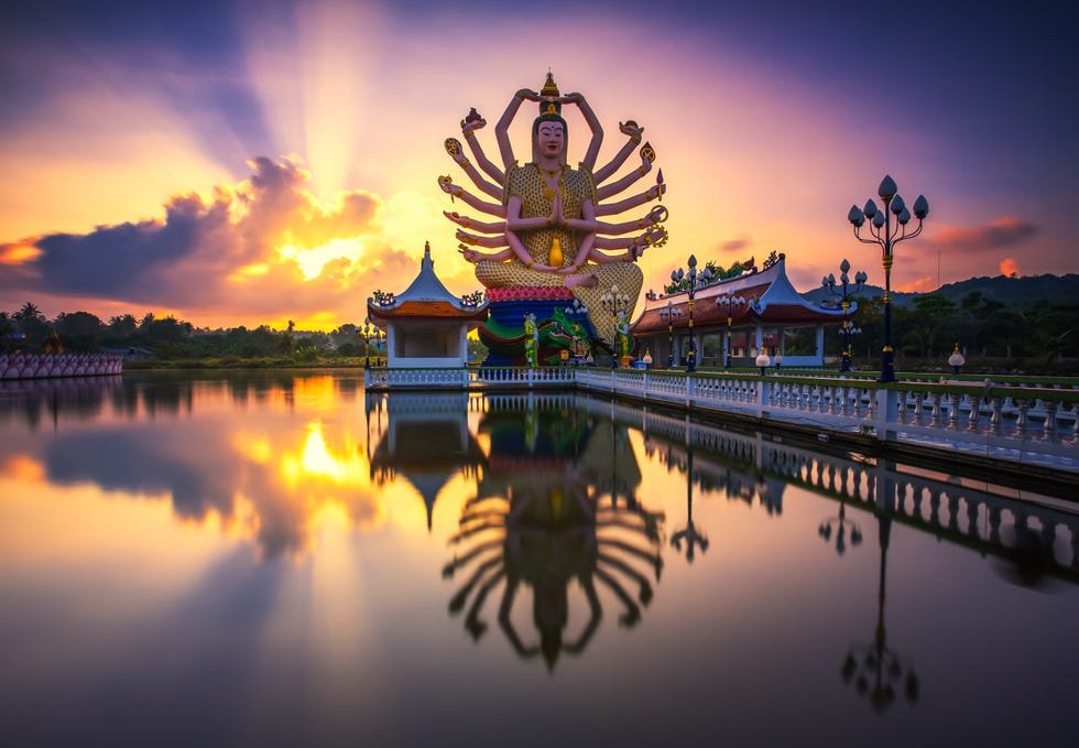 Wat Plai Laem Temple Buddha Statue at Sunrise