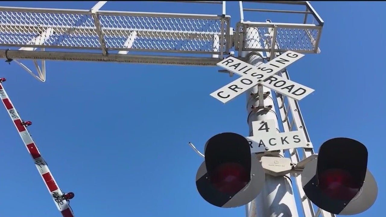 Trains stopped at railroad crossings for hours hurting business, cafe owner says