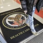 A visitor leaves the Sacramento Veterans Affairs Medical Center in Rancho Cordova, Calif.